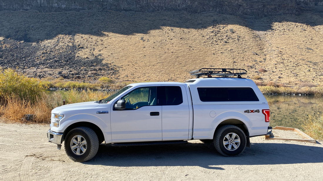 F150 with ARE camper shell and rack for overlanding and exploration